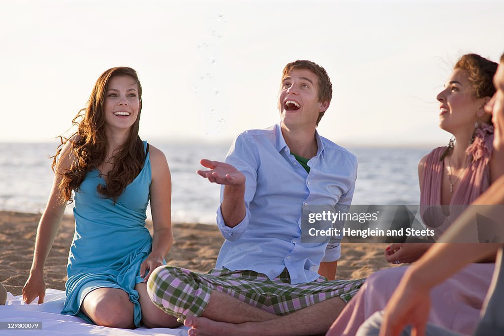 People relaxing together on beach