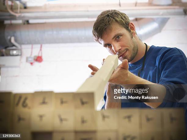 worker checking staircase bannister railings in joinery - hull uk stock pictures, royalty-free photos & images