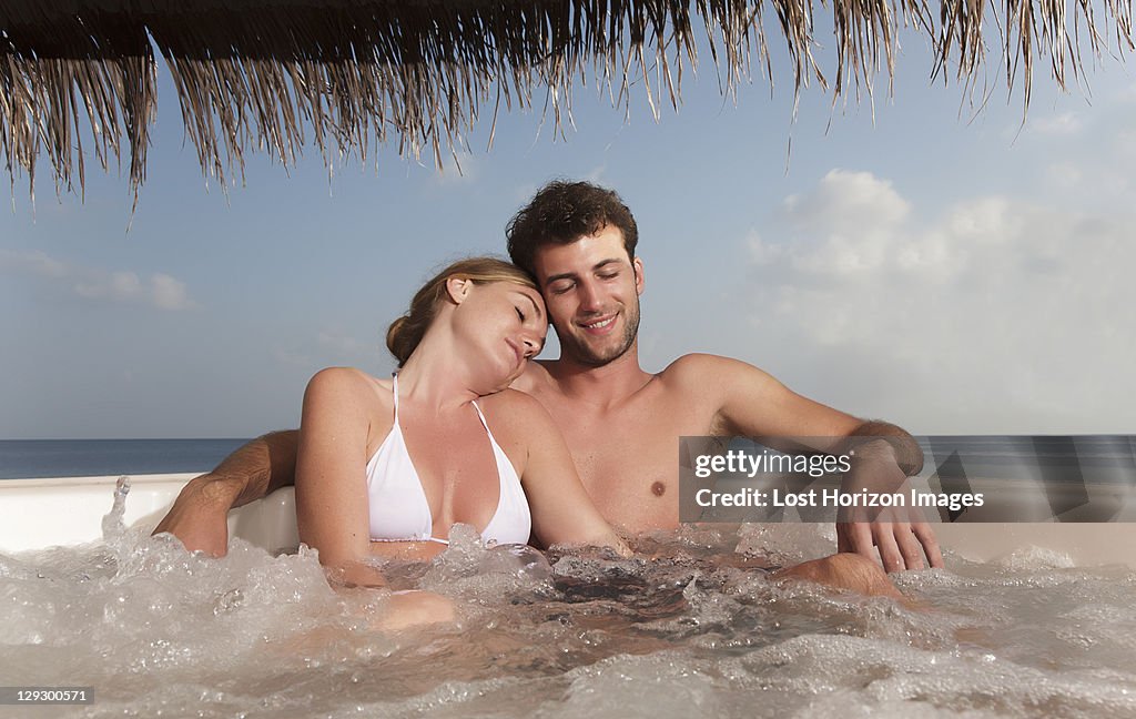 Couple embracing in hot tub
