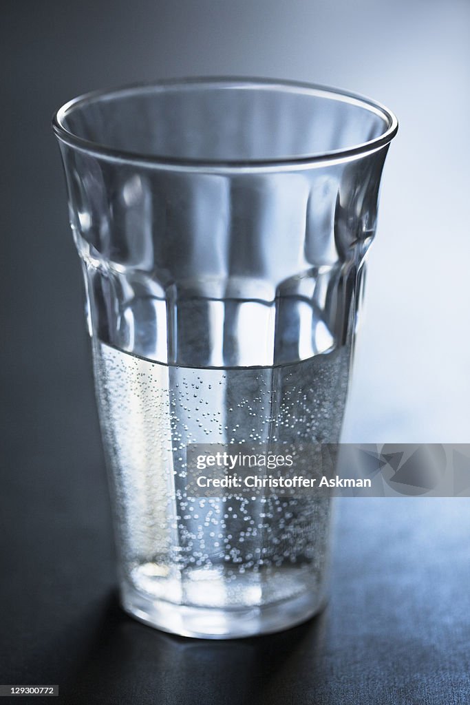 Air bubbles in glass of water