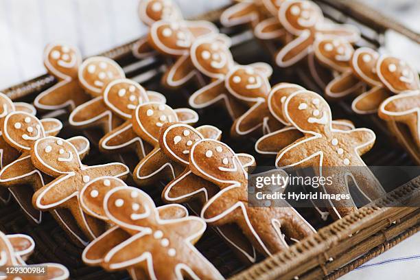 close up of gingerbread men cookies - gingerbread cookie stock pictures, royalty-free photos & images