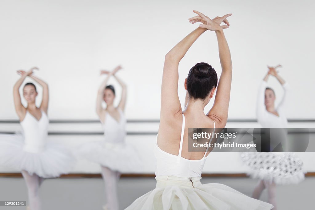 Ballet dancers posing in studio