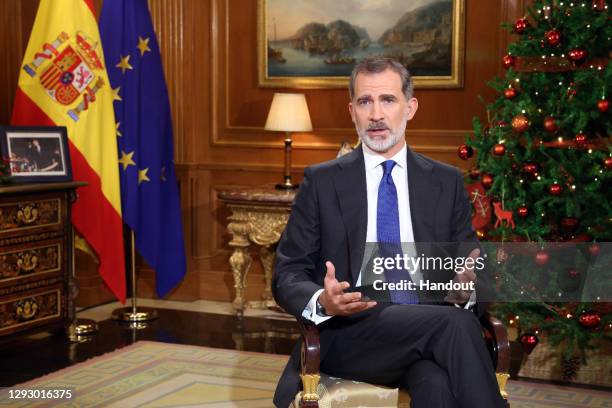 In handout image provided by the Spanish Royal Household, King Felipe of Spain is seen delivering the traditional Christmas speech at the Royal House...