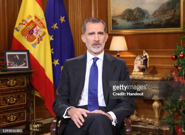 In handout image provided by the Spanish Royal Household, King Felipe of Spain is seen delivering the traditional Christmas speech at the Royal House...