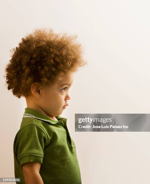 serious mixed race boy - purity stock pictures, royalty-free photos & images