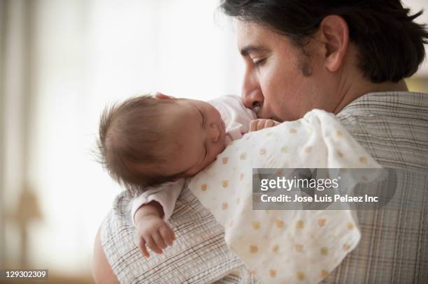 hispanic father holding newborn baby girl - baby sleeping stock pictures, royalty-free photos & images
