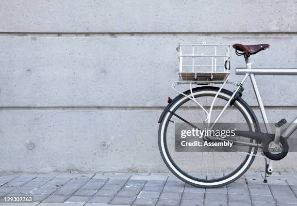 bicycle parked on urban sidewalk - bicycle basket stock pictures, royalty-free photos & images