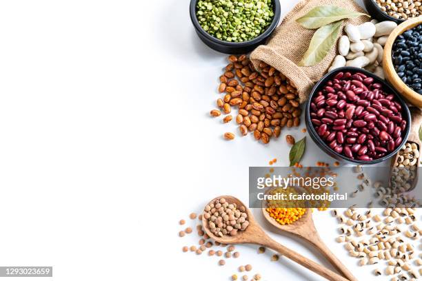 beans variation shot from above on white background with copy space - bean stock pictures, royalty-free photos & images