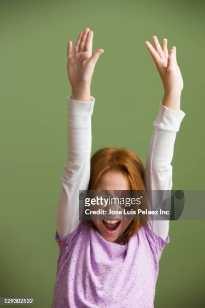 excited caucasian girl with arms raised - freckle arm stock pictures, royalty-free photos & images