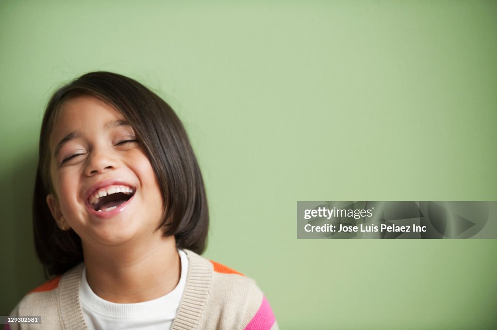 Laughing mixed race girl