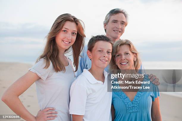 caucasian family enjoying beach - mother with daughters 12 16 stock-fotos und bilder