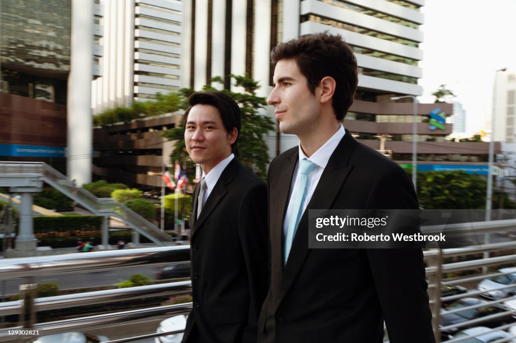 Businessmen walking together outdoors