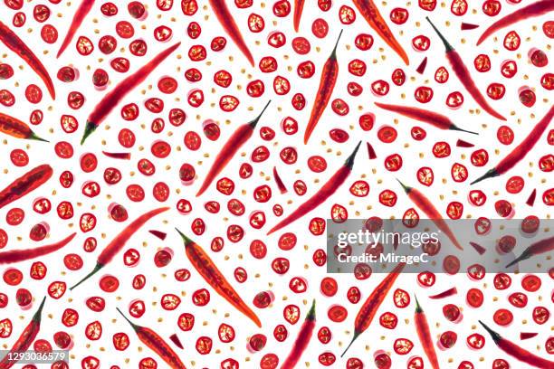 chili pepper slices back lit pattern - red pepper stock pictures, royalty-free photos & images