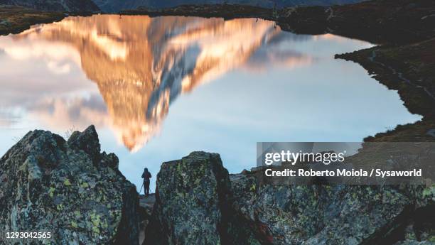 man photographing matterhorn reflected in stellisee lake - valais canton stock pictures, royalty-free photos & images