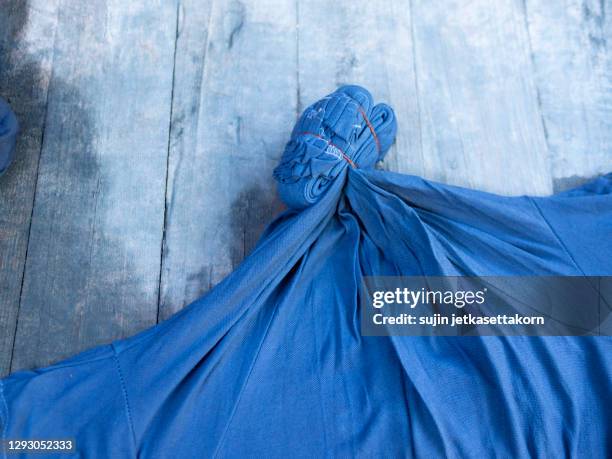 how to made indigo dyed cloth, cloth in indigo color at thailand - dye stock pictures, royalty-free photos & images