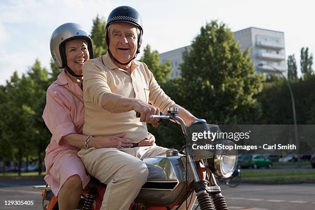 senior couple on motorbike - old couple adventure stock-fotos und bilder