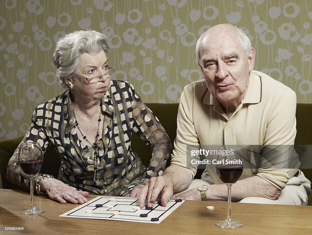 Senior woman looks shocked by man's muehle tactics