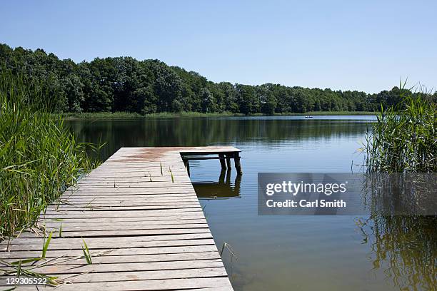 lake and jetty - jetty ストックフォトと画像