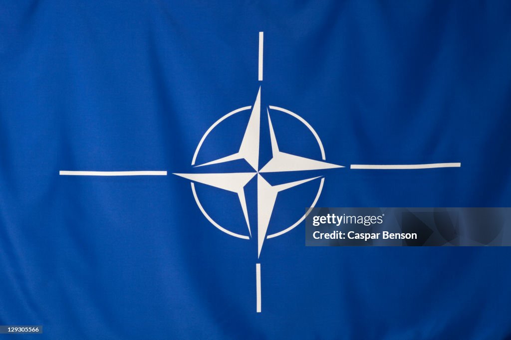 North Atlantic Treaty Organization flag, white compass rose emblem in blue background