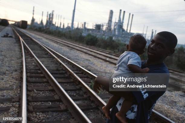 Oil and chemical refinery plants cover the landscape, next to African American communities along the Mississippi River, October south of Baton Rouge,...