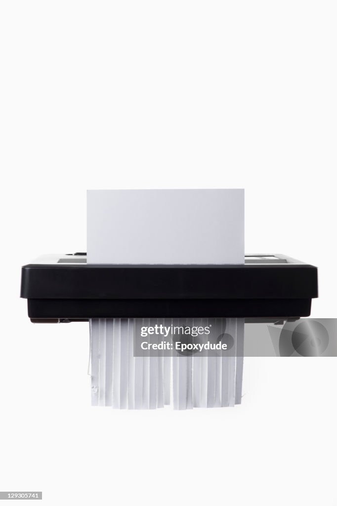 A blank document in a paper shredder