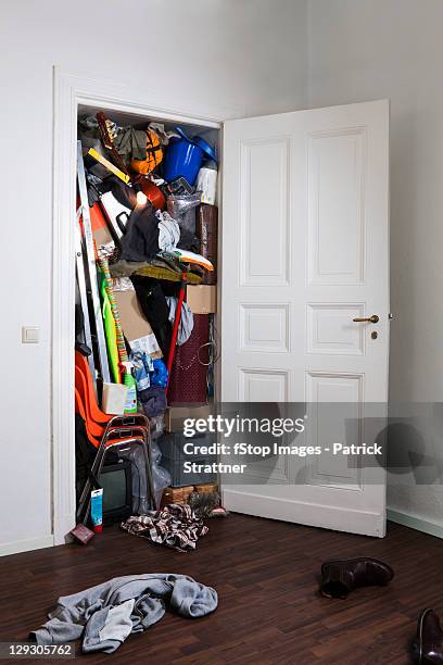 a closet stuffed with various storage items - walk in closet stock pictures, royalty-free photos & images