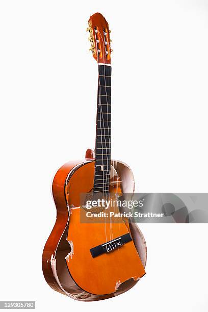 a broken acoustic guitar - broken musical instrument stock pictures, royalty-free photos & images