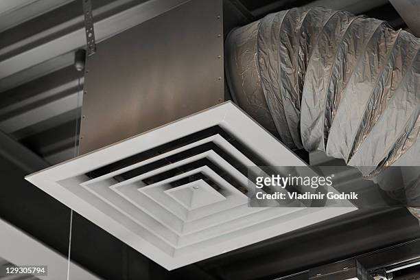 an air duct hanging from a ceiling, close-up, low angle view - air vent stock pictures, royalty-free photos & images