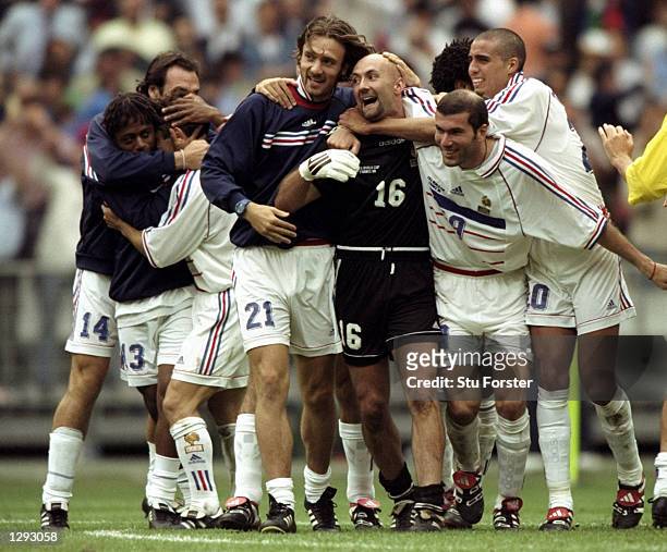Alan Boghossian, Bernard Diomede, Bixente Lizarazu, Christophe Dugarry, Fabien Barthez, Zinedine Zidane and David Trezeguet all of France celebrate...