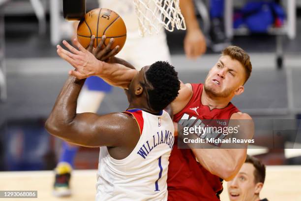Meyers Leonard of the Miami Heat fouls Zion Williamson of the New Orleans Pelicans during the second quarter at American Airlines Arena on December...