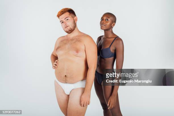 portrait of a young couple wearing underwear - men wearing bras photos stock pictures, royalty-free photos & images