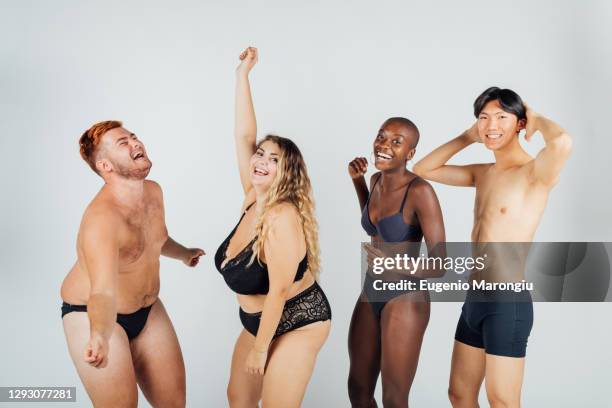 group of young people dancing, wearing underwear - curvy woman photos et images de collection