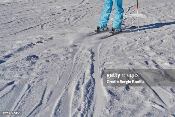 cropped view, people skiing at formigal, spain - ski pants stock-fotos und bilder