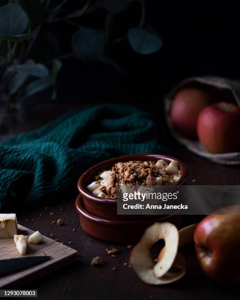 apple crumble in action - apple crumble stock pictures, royalty-free photos & images