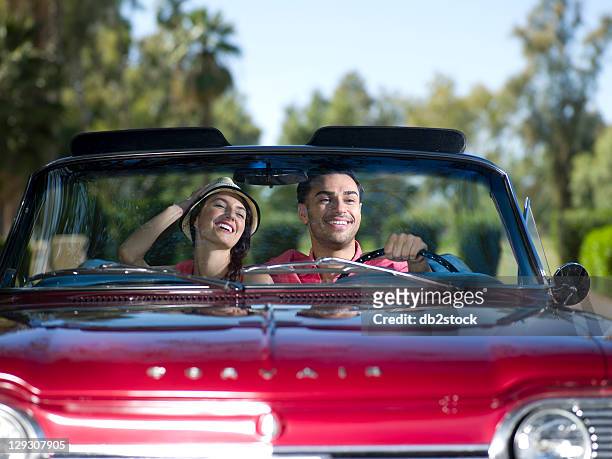 usa, arizona, scottsdale, young couple driving convertible car - spider foto e immagini stock