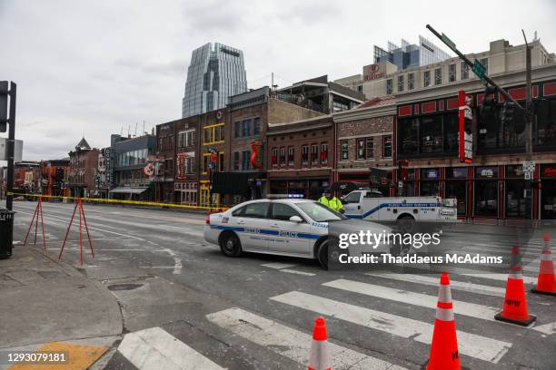 Police car blocks the street after an explosion on December 25, 2020 in Nashville, Tennessee. According to initial reports, a vehicle exploded...