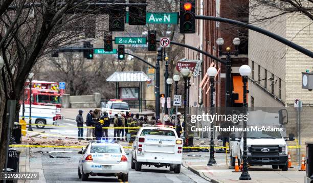 And first responders work on the scene after an explosion on December 25, 2020 in Nashville, Tennessee. According to initial reports, a vehicle...