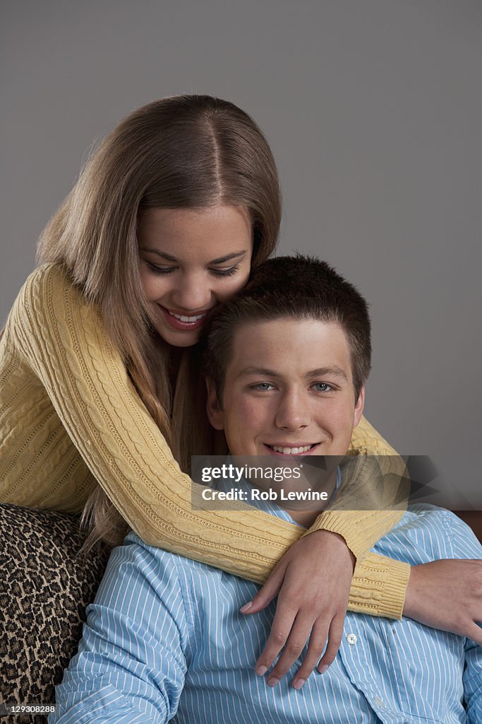 Portrait of teenage couple (16-17), studio shot