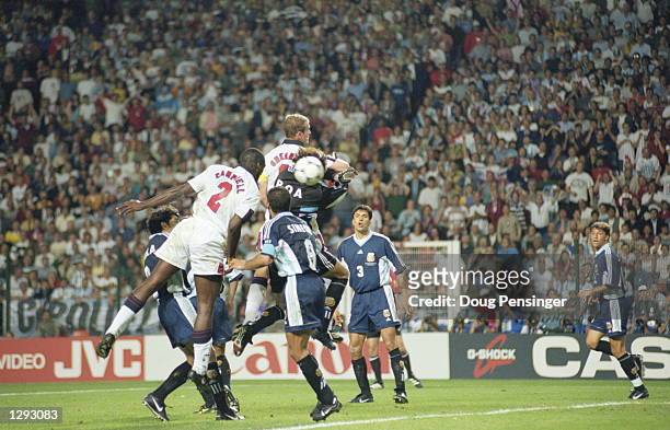 Sol Campbell of England rises to head the ball into the back of the Argentina net, but the goal is disallowed for Alan Shearer's elbow on goalkeeper...