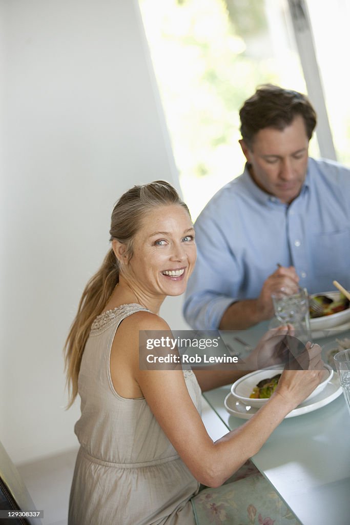 Mature couple eating meal
