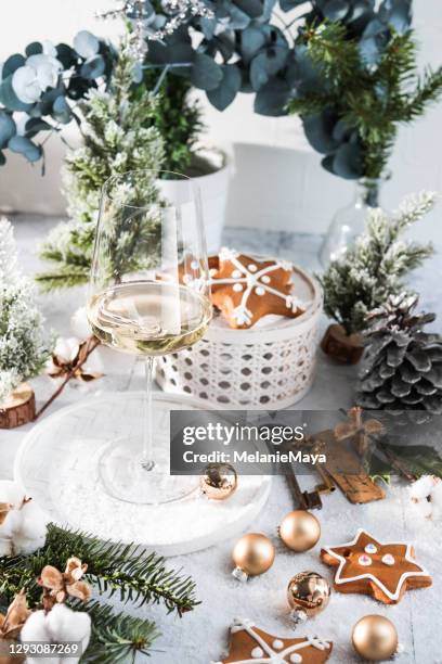 elegant wine glass in bright  christmas winter scene - advent party stock pictures, royalty-free photos & images