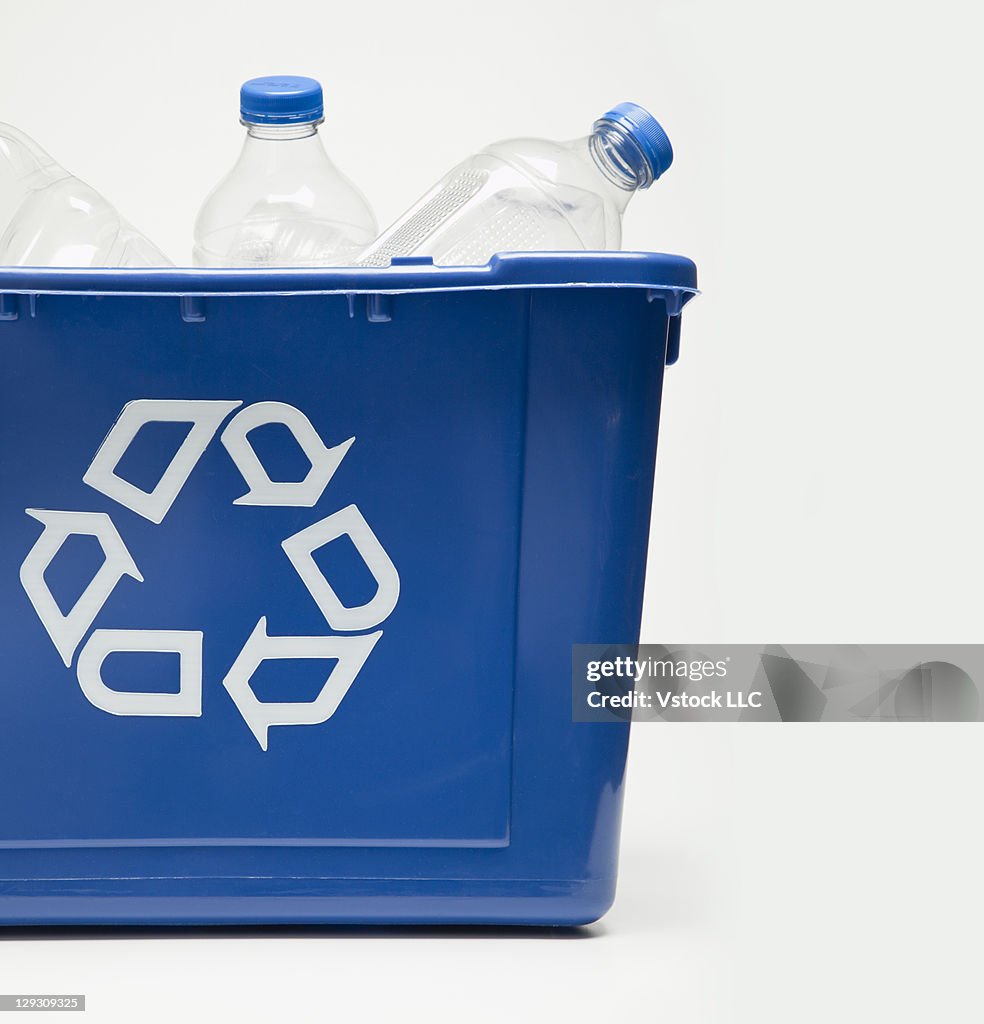 Studio shot of recycling bin with bottles