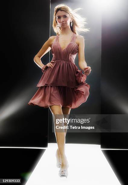 female fashion model wearing dress on catwalk - leg show stock pictures, royalty-free photos & images