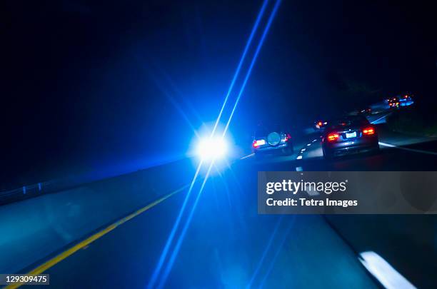 usa, connecticut, car headlights on road at night - headlamp stock pictures, royalty-free photos & images