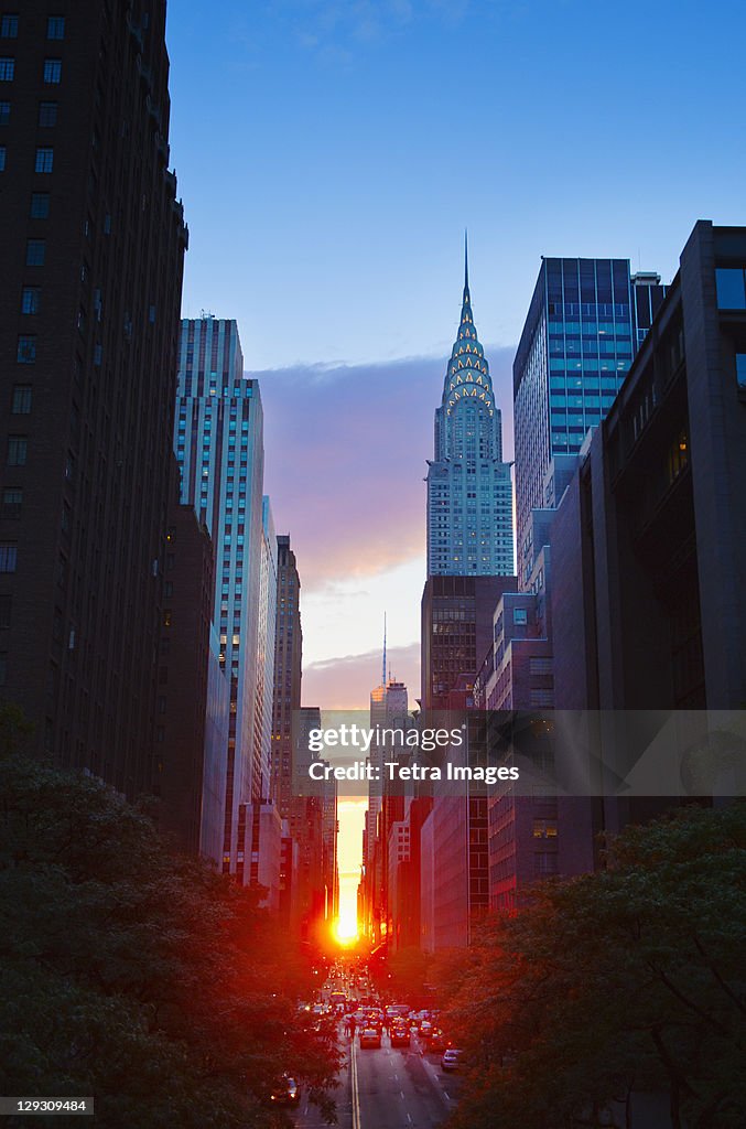 USA, New York, New York City, Chrysler Building and street at sunset