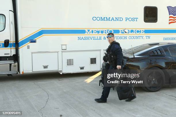 Police close off an area damaged by an explosion on Christmas morning on December 25, 2020 in Nashville, Tennessee. A Hazardous Devices Unit was en...