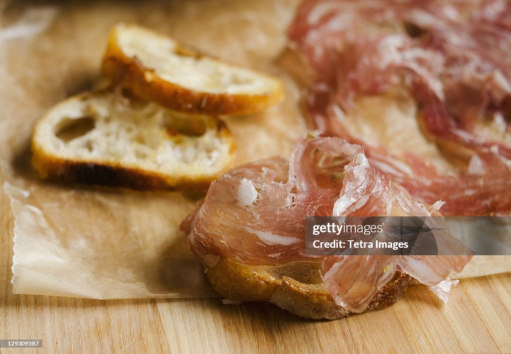 Fresh prosciutto ham with bread