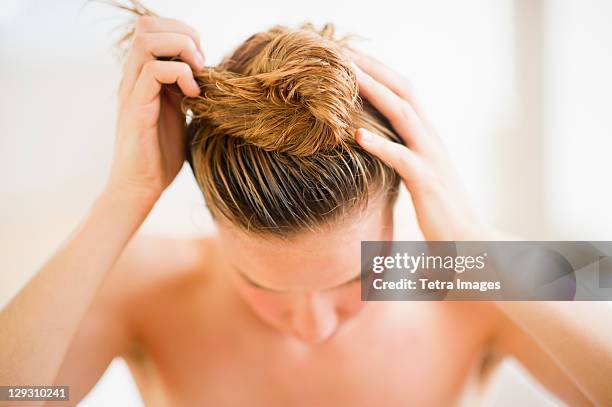 usa, new jersey, jersey city, woman washing hair - blonde hair roots stock pictures, royalty-free photos & images