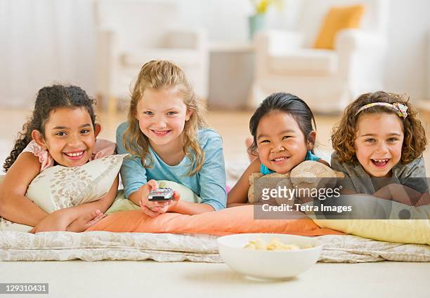usa, new jersey, jersey city, portrait of girls (6-9) watching tv - children only stock pictures, royalty-free photos & images