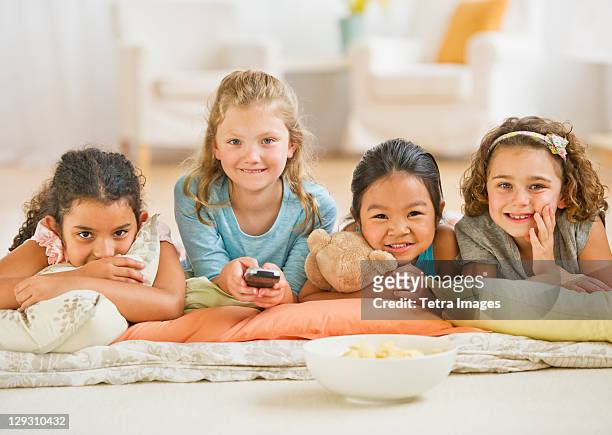 usa, new jersey, jersey city, portrait of girls (6-9) watching tv - children only stock pictures, royalty-free photos & images